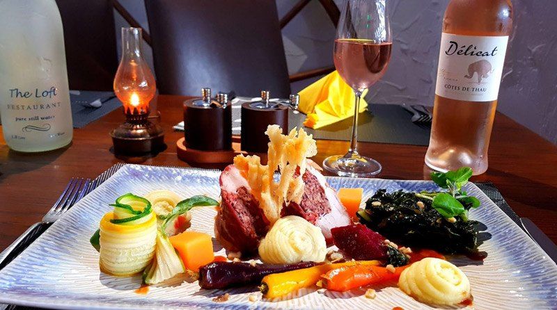 A plated dinner main course served at The Loft restaurant next door to The Roundhouse Inn